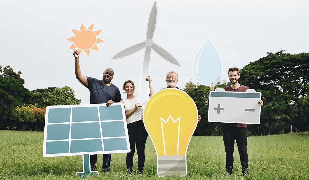 Bürgerenergie - Wertschöpfung für alle Menschen halten Symbole für saubere und regenerative Energie